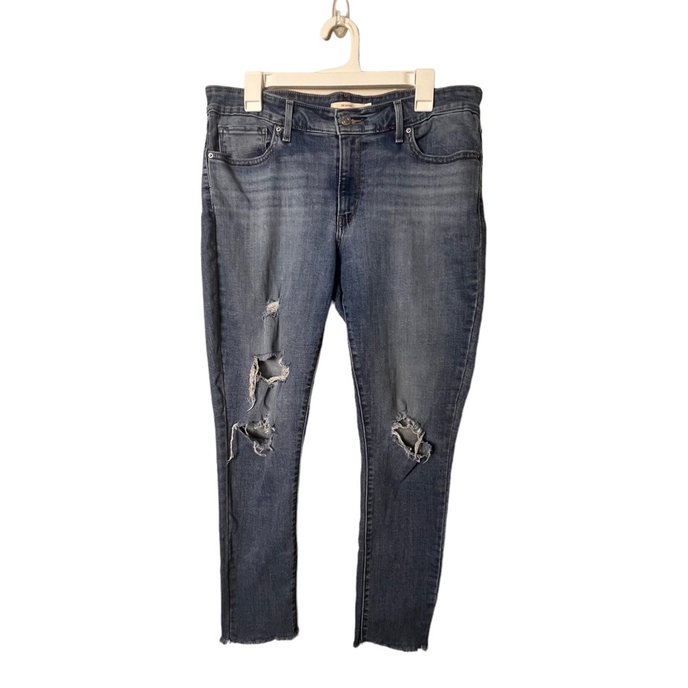 Levi’s 711 Skinny Jeans Medium Wash Distressed Raw Hem  Womens Size 32